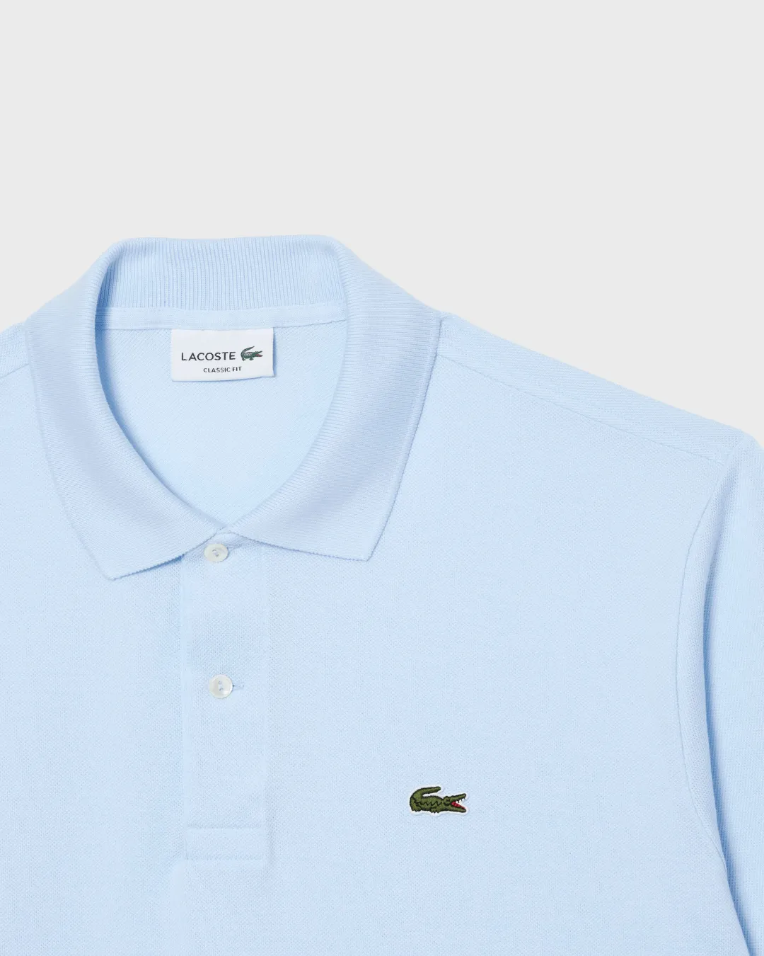 REMERA  CUELLO POLO LACOSTE CELESTE
